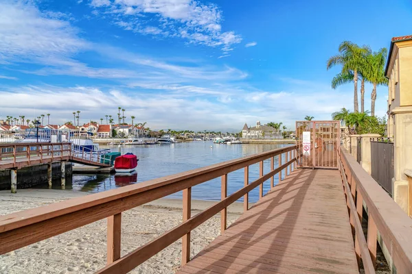 Docks overlooking the sea and waterfront houses in Huntington Beach California