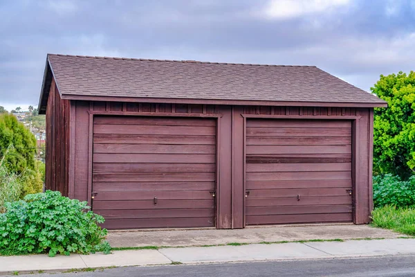 Detached two car garage of home in San Diego California with sky background