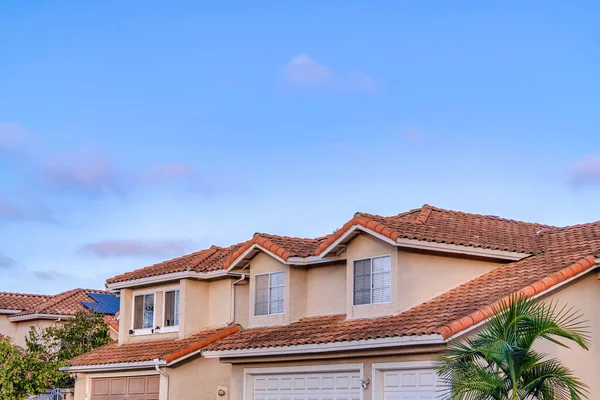 Exterior of house with roof shingles and attached garage in San Diego Califronia