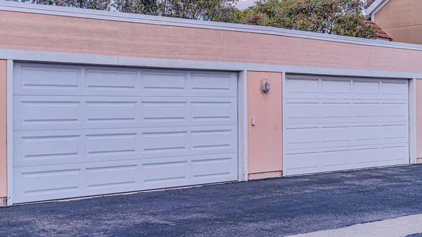 Pano Facade of two car garage of home in Huntington Beach California neighborhood