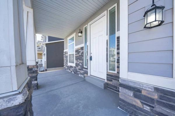 Side view of a white front door of a house with a view of neighbors house — Stock Photo, Image