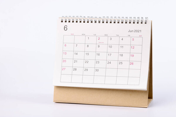 Applied paper calendar standing on white background