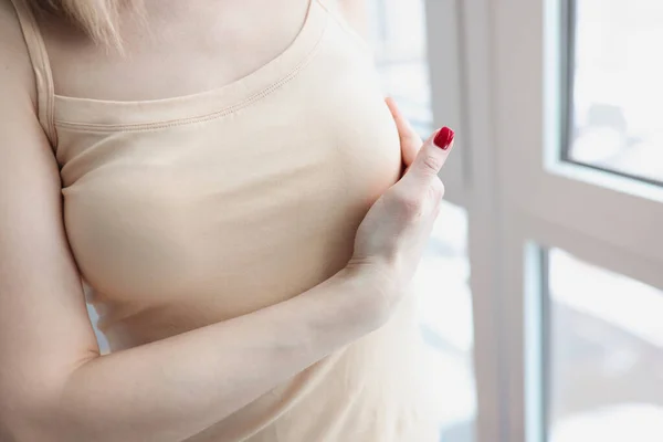 Woman hand examining mammary gland at home closeup — Stock Photo, Image