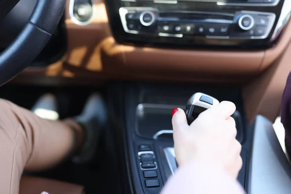 Woman hand holding automatic transmission lever closeup — Stock Photo, Image