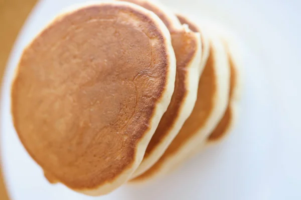 Flour toasted pancakes on white plate closeup — Stock Photo, Image
