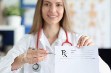 Woman medicine doctor holding hand gives prescription to patient closeup clipart