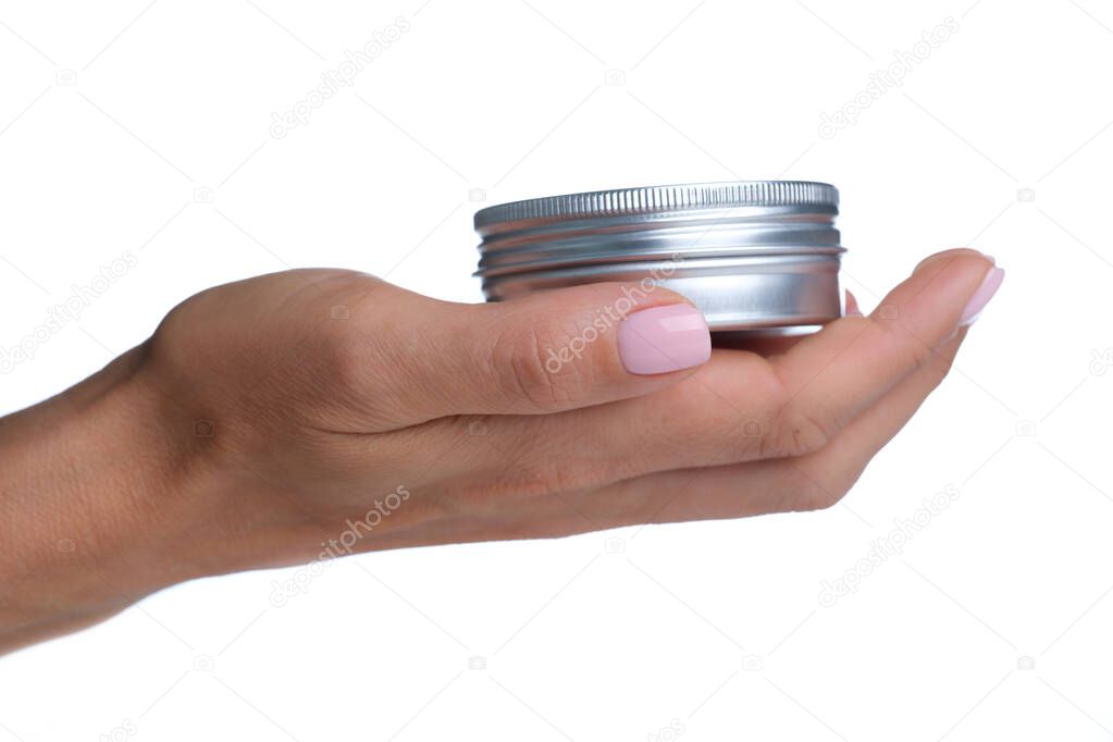 In woman hand there is silvery aluminum cosmetic jar