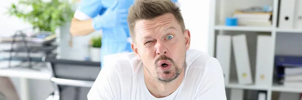 Surprised man undergoes medical examination by proctologist — Stock Photo, Image