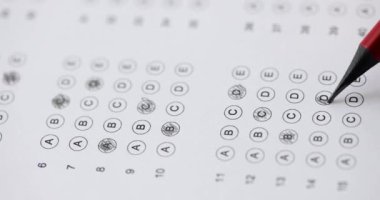 Female hand holds pencil and marks answers to test 4k movie