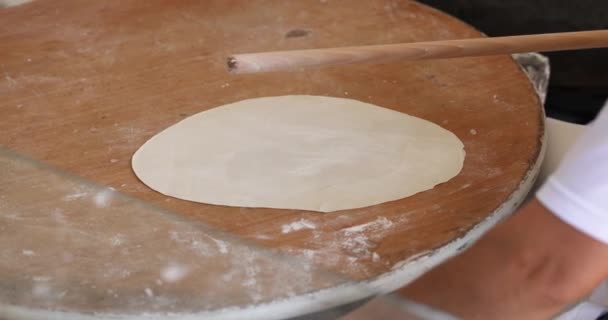 Cook rolls out dough for making pancakes 4k movie — Stock videók