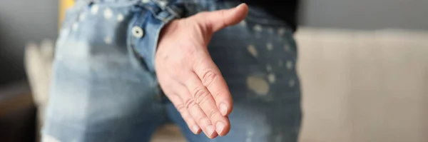 Man offers a handshake through fly of his pants — Stock Photo, Image