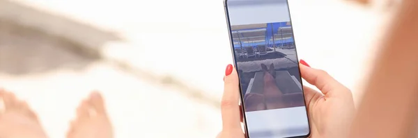 Woman is editing taken photo on smartphone
