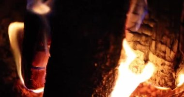 Burning smoldering wood and coals in fireplace 4k movie
