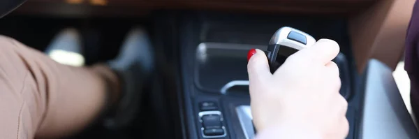 Woman hand holding automatic transmission lever closeup — Stock Photo, Image