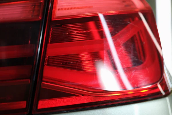 Car headlight polished before and after in workshop — Stock Photo, Image