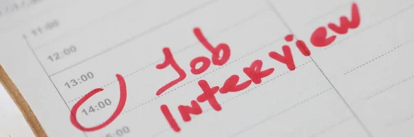 Job interview note written in red marker in diary closeup — Stock Photo, Image