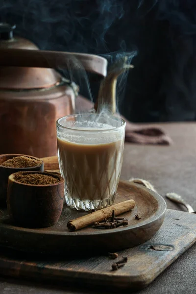 indian spicy tea masala, hot and delicious traditional drink of tea, milk and spices