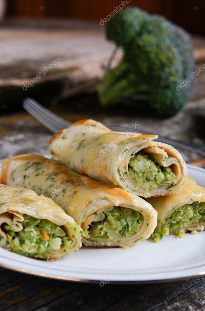 Pancakes stuffed with broccoli and cheese Stock Photo by ©BelarusianArt