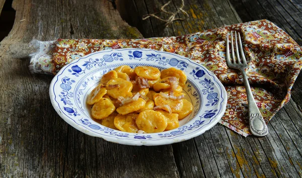 Pumpkin gnocchi with greaves — Stock Photo, Image