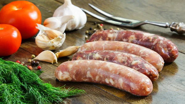 Homemade raw sausages - chicken and beef sausages with garlic and spices