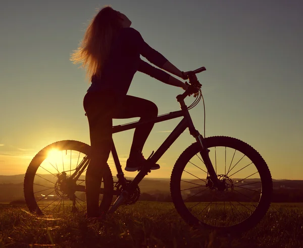 Girl on a bicycle — Stock Photo, Image