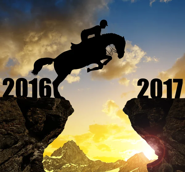 The rider on the horse jumping into the New Year 2017 — Stock Photo, Image