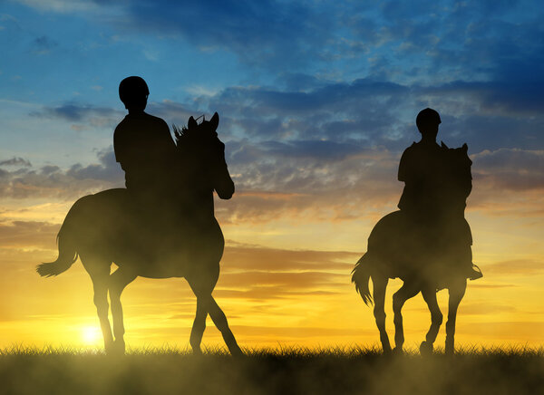 Silhouette two riders on horse