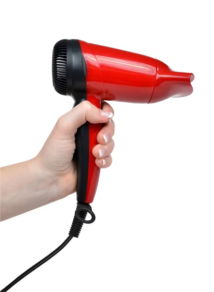 Secador de cabelo vermelho compacto na mão — Fotografia de Stock