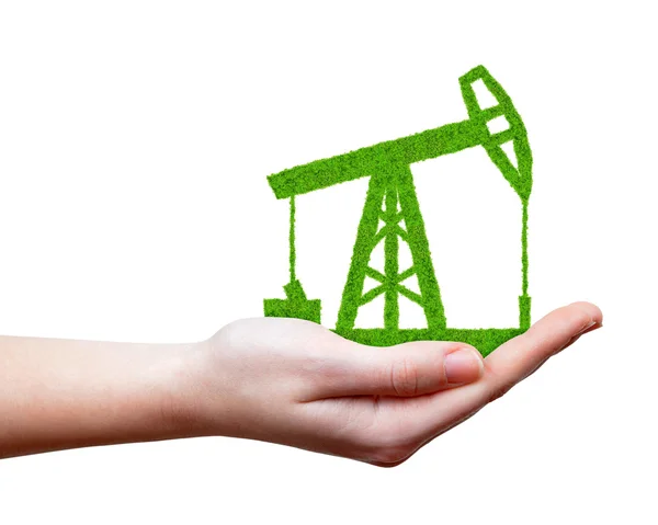 Groene olie pomp in de hand — Stockfoto