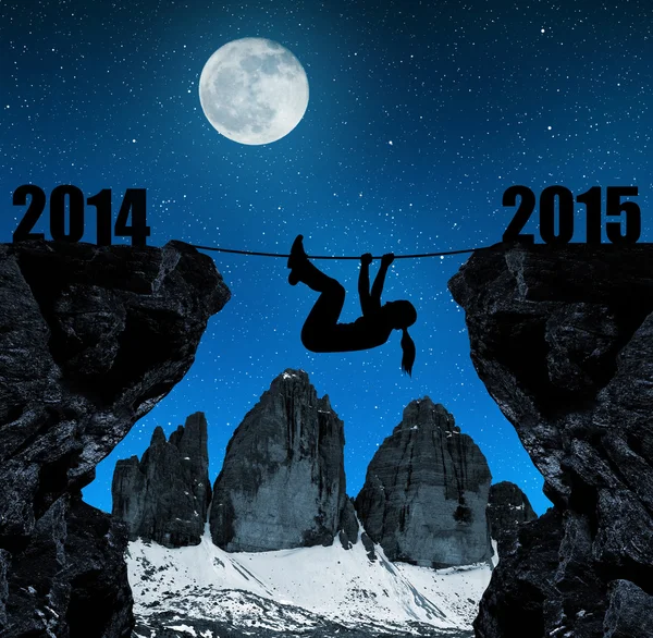Girl climbs into the New Year 2015 — Stock Photo, Image