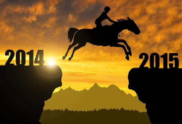 The rider on the horse jumping into the New Year 2015 — Stock Photo, Image