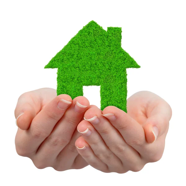 Handen met groen huis symbool — Stockfoto