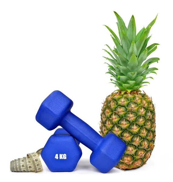 Blue fitness dumbbells with pineapple — Stock Photo, Image