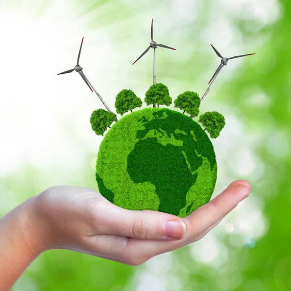 Green planet with trees and wind turbines — Stock Photo, Image