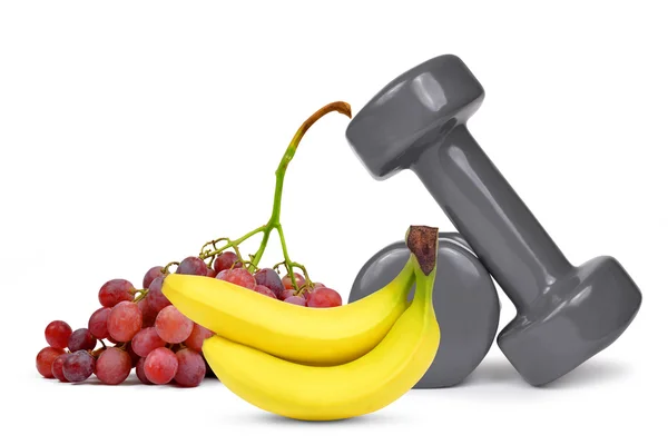 Fitness dumbbells with grapes and banana — Stock Photo, Image