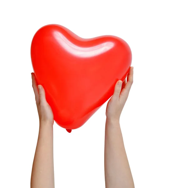 Balloon in the shape heart in hands — Stock Photo, Image