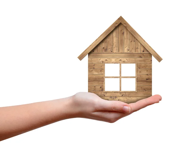 Wooden house in hand — Stock Photo, Image