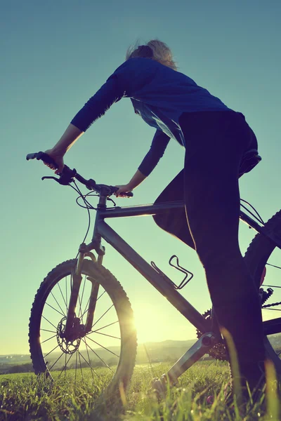 Girl on a bicycle — Stock Photo, Image