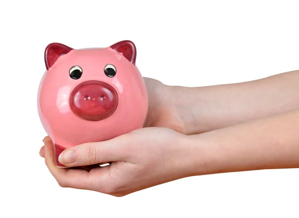 Woman hands holding a pink piggy bank — Stock Photo, Image