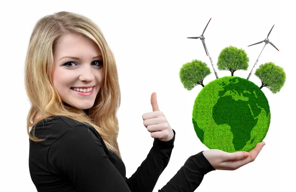 Girl holding in hand green planet with trees and wind turbines. — Stock Photo, Image