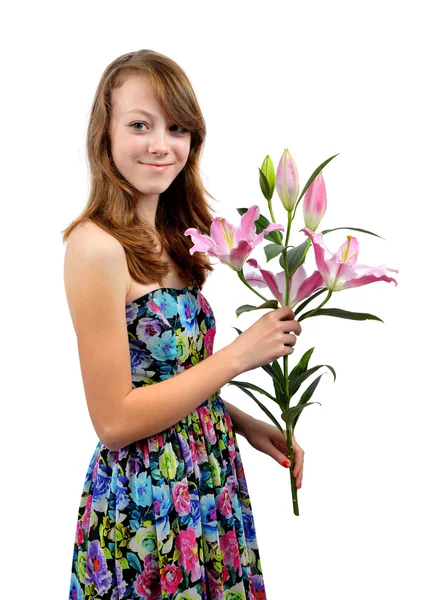 Girl with floral dress holding lily — Φωτογραφία Αρχείου