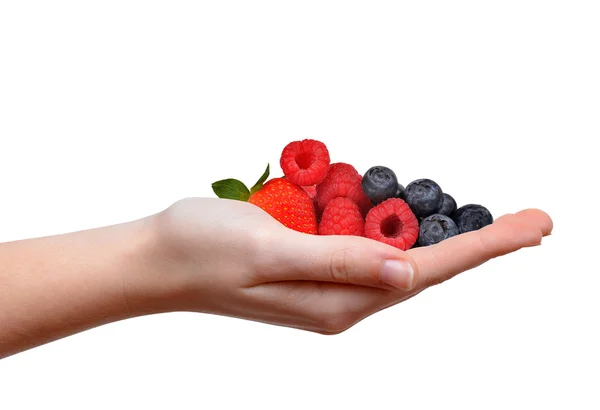 Strawberry with blueberries and raspberries in hand — Stockfoto