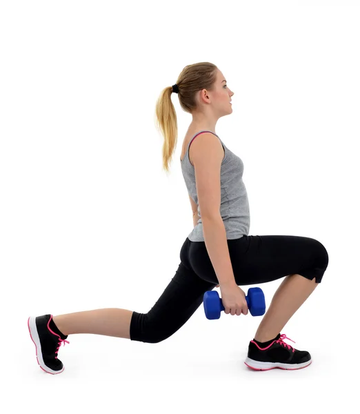 Mädchen trainieren Oberschenkelmuskeln mit Kurzhanteln — Stockfoto