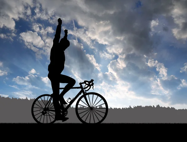 Silhouette del ciclista in sella ad una bici da strada — Foto Stock