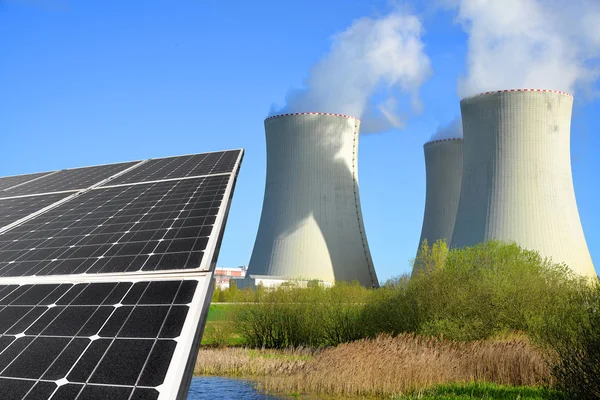 Solar energy panels and nuclear power plant — Stock Photo, Image