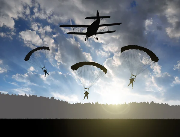 Silhouette skydiver parachutist landing — Stock Photo, Image