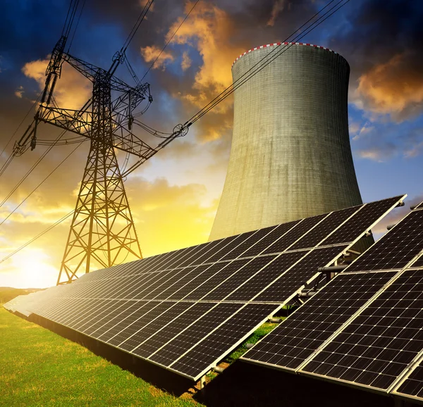 Solar energy panels, nuclear power plant and electricity pylon — Stock Photo, Image