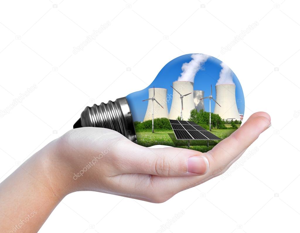 Hand holding eco lightbulb isolated on white background.