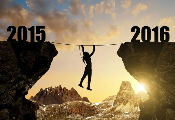 Girl climbs into the New Year 2016 — Stock Photo, Image