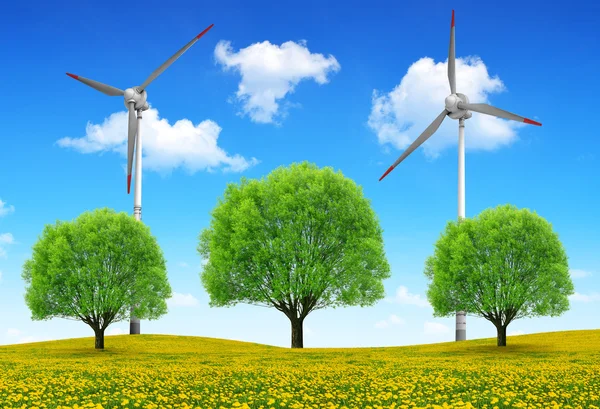 Trees with wind turbines on meadow. — Stock Photo, Image